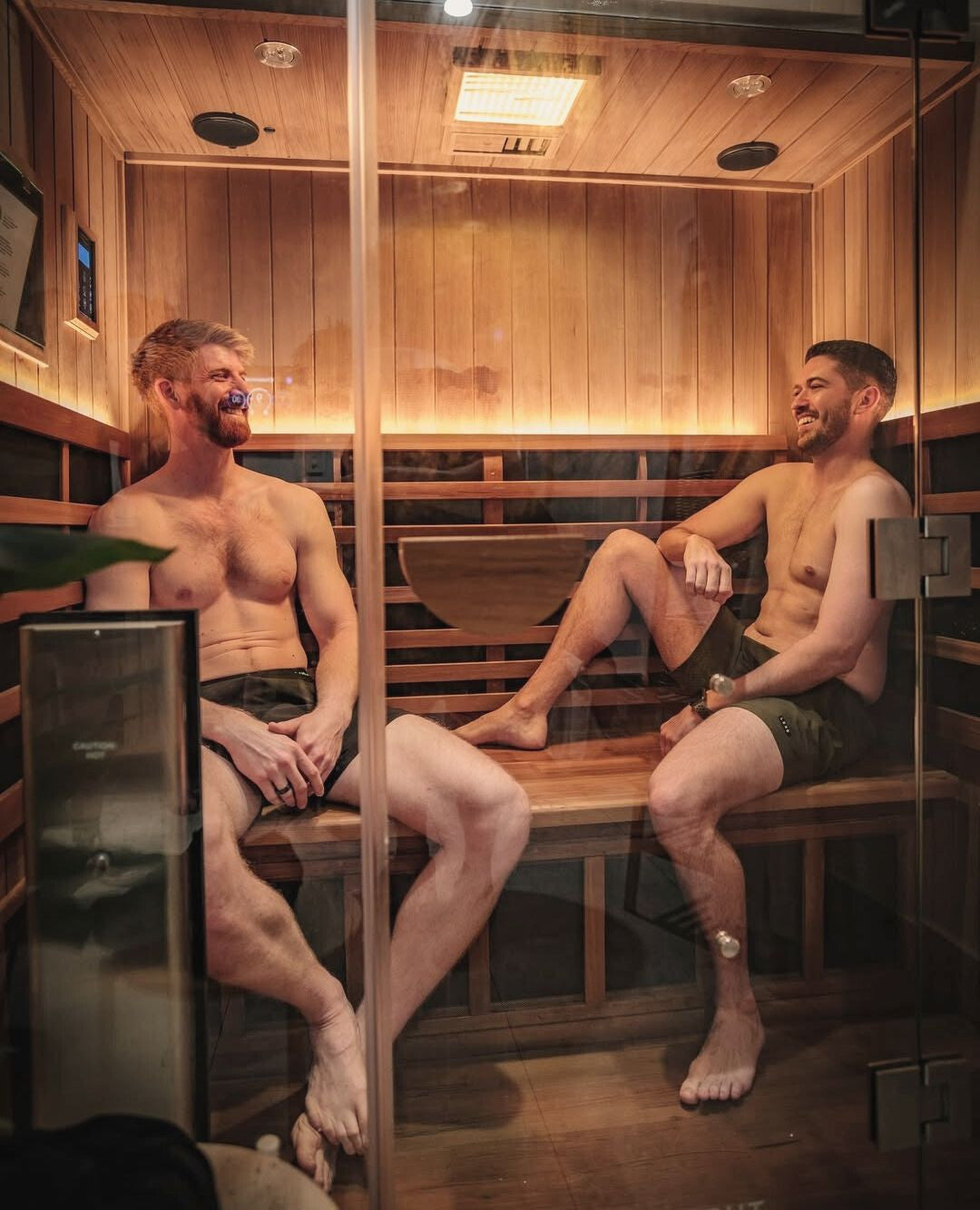 Image taken from templegymparkwood instagram of 2 men in a Clearlight Sauna. 24/7 Gym, Infrared Sauna & Cold Plunge Pools, Hot Yoga & Pilates, Group Training Classes, Personal Training, Temple Gym Cafe. Located in Parkwood on the Gold Coast.
