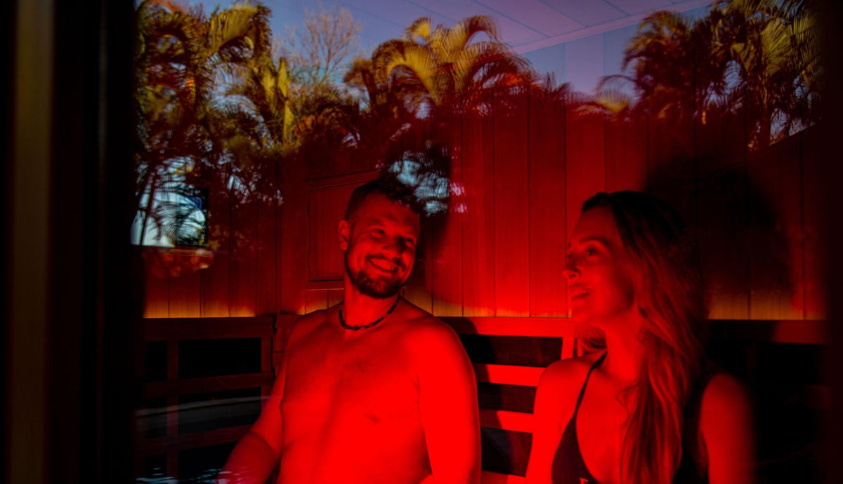 Couple enjoying an infrared sauna session together